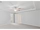 Primary bedroom featuring a tray ceiling, neutral paint, and access to the Primary bathroom at 6104 Marigold Way, Atlanta, GA 30349
