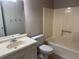 This bathroom features a shower-tub combo, toilet, vanity, and tiled floors at 861 Creek Trail Nw, Kennesaw, GA 30144