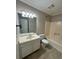 Standard bathroom featuring a vanity, toilet, and shower/tub combo at 861 Creek Trail Nw, Kennesaw, GA 30144
