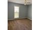 A clean bedroom with neutral tones and a large window providing natural light at 861 Creek Trail Nw, Kennesaw, GA 30144