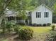 Beautiful home with manicured lawn and inviting front porch at 861 Creek Trail Nw, Kennesaw, GA 30144