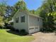 Home featuring an attached garage and lush green lawn at 861 Creek Trail Nw, Kennesaw, GA 30144