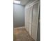 Hallway with large bi-fold closet doors and tile flooring at 861 Creek Trail Nw, Kennesaw, GA 30144