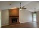 Spacious living room features a brick fireplace, ceiling fan, and ample natural light at 861 Creek Trail Nw, Kennesaw, GA 30144