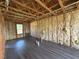 Unfinished basement with insulation, wood beams, and laminate flooring at 132 Peggy Meadows Way, Douglasville, GA 30134