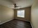 Bright bedroom with wood-look floors and large window at 132 Peggy Meadows Way, Douglasville, GA 30134