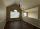 Bright bonus room with wood-look floors, high ceilings, and large window at 132 Peggy Meadows Way, Douglasville, GA 30134