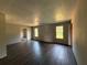 Spacious living room featuring hardwood floors and two windows, providing natural light at 132 Peggy Meadows Way, Douglasville, GA 30134