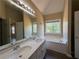 Main bathroom with double sink vanity, soaking tub, and separate shower at 132 Peggy Meadows Way, Douglasville, GA 30134