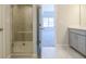 Contemporary bathroom with tiled shower and a vanity with light gray cabinets at 1996 Deco Dr, Kennesaw, GA 30144