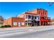 Historic brick building featuring unique architectural details and multiple storefronts at 1996 Deco Dr, Kennesaw, GA 30144