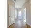 Inviting entryway features a light-filled space with a white door and beautiful hardwood floors at 1996 Deco Dr, Kennesaw, GA 30144