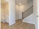 Bright entryway boasting hardwood floors, with a staircase and access to a bathroom at 1996 Deco Dr, Kennesaw, GA 30144