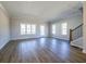 Spacious living room showcasing wood floors, neutral paint, recessed lighting, and natural light at 1996 Deco Dr, Kennesaw, GA 30144