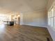 Open-concept living room and kitchen featuring wood floors, recessed lighting, and abundant natural light at 1996 Deco Dr, Kennesaw, GA 30144