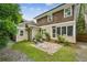 Charming backyard with a stone patio and access to a screened in porch offering outdoor comfort at 261 Elmira Ne Pl, Atlanta, GA 30307