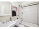 Updated bathroom with a subway tiled shower and white fixtures at 261 Elmira Ne Pl, Atlanta, GA 30307