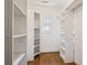 Walk-in closet with custom shelving and storage racks at 261 Elmira Ne Pl, Atlanta, GA 30307