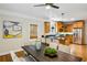 Open-concept kitchen and dining area with seating for six and modern appliances at 261 Elmira Ne Pl, Atlanta, GA 30307