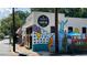 Sean's Candler Park exterior featuring colorful mural, signage and patio seating at 261 Elmira Ne Pl, Atlanta, GA 30307
