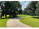Picturesque green space with winding paved trail, perfect for walking, jogging, and enjoying the outdoors at 261 Elmira Ne Pl, Atlanta, GA 30307