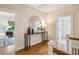 Upstairs hallway featuring wood floors and decorative mirror at 261 Elmira Ne Pl, Atlanta, GA 30307