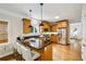 Kitchen island with breakfast bar, stainless steel appliances and hardwood floors at 261 Elmira Ne Pl, Atlanta, GA 30307
