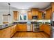 A kitchen with stainless steel appliances, wooden cabinets and granite countertops at 261 Elmira Ne Pl, Atlanta, GA 30307