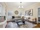 Inviting living room with built-in shelving, stylish decor, and comfortable seating arrangement at 261 Elmira Ne Pl, Atlanta, GA 30307