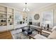 Comfortable living room with built-in bookshelves and decorative lighting, showcasing a cozy ambiance at 261 Elmira Ne Pl, Atlanta, GA 30307