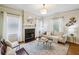 Bright living room featuring a fireplace, neutral decor, and abundant natural light from the window at 261 Elmira Ne Pl, Atlanta, GA 30307
