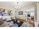 Elegant living room featuring stylish furniture, decorative wall art, and an open view to the adjacent room at 261 Elmira Ne Pl, Atlanta, GA 30307