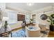 Bright home office with a vintage desk, chair seating, and natural light from the windows at 261 Elmira Ne Pl, Atlanta, GA 30307