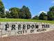 Freedom Park City of Atlanta stone signage with manicured lawn and trees at 261 Elmira Ne Pl, Atlanta, GA 30307