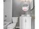 A modern bathroom with a vanity, toilet, and shower-tub combination at 5575 Wells Circle, Stone Mountain, GA 30087
