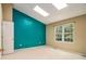 A bright bedroom with natural light from two skylights and a large window at 5575 Wells Circle, Stone Mountain, GA 30087