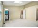 A spacious bedroom with carpet flooring and multiple doorways at 5575 Wells Circle, Stone Mountain, GA 30087
