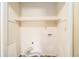 A spacious walk-in closet with shelving and laundry connections at 5575 Wells Circle, Stone Mountain, GA 30087