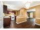 Modern kitchen featuring hardwood floors, stylish lighting, and a convenient layout for cooking and entertaining at 5575 Wells Circle, Stone Mountain, GA 30087