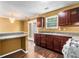 A well-lit kitchen with wooden cabinets, granite countertops, and modern appliances at 5575 Wells Circle, Stone Mountain, GA 30087