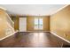 Bright and airy living room showcasing hardwood floors, large windows, and neutral walls at 5575 Wells Circle, Stone Mountain, GA 30087
