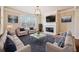 Cozy living room featuring hardwood floors, stylish furniture, a fireplace, and a large window at 6404 Brookside Se Blvd, Mableton, GA 30126