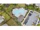 Aerial view of a community pool and parking lot surrounded by landscaping and homes at 1998 Lakeview Bend Way, Buford, GA 30519