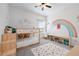 A room with custom rainbow paint and a unique bunk bed design at 1998 Lakeview Bend Way, Buford, GA 30519