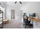 Brightly lit bedroom with neutral carpet, a large window and a desk in the corner at 1998 Lakeview Bend Way, Buford, GA 30519