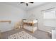 This room has a unique bunk bed with drawers and a polka dot rug at 1998 Lakeview Bend Way, Buford, GA 30519