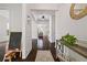 Bright foyer boasts hardwood floors, elegant trim, and views into the living spaces at 1998 Lakeview Bend Way, Buford, GA 30519