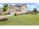 Exterior shot showcasing the lawn, garage and side of the home at 1998 Lakeview Bend Way, Buford, GA 30519