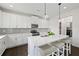 Bright kitchen featuring white countertops and stainless steel appliances at 1998 Lakeview Bend Way, Buford, GA 30519