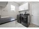 Convenient laundry room with modern appliances and countertop space at 1998 Lakeview Bend Way, Buford, GA 30519